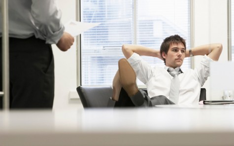 Businessman Reclining On Chair And Ignoring Boss